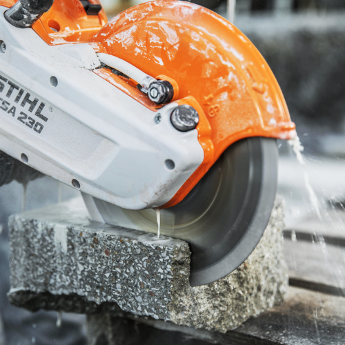 A Stihl stone saw cutting into rock.