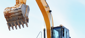 A close up of a loader on a clear day.