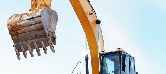 A close up of a loader on a clear day.